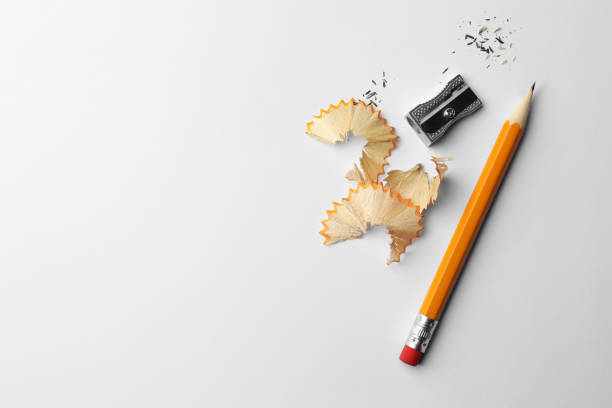 istock Graphite pencil, shavings and sharpener on white background, flat lay. Space for text 1468279660