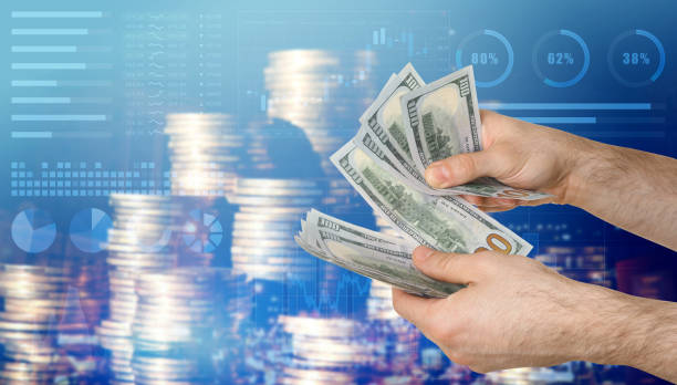 istock Stock exchange. Man counting dollar banknotes, closeup. Double exposure of graphs with statistic information and coins 1468283463