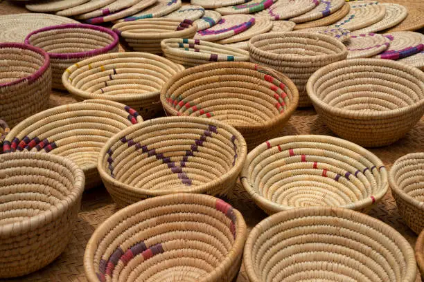 Rattan woven bowls and trivets for sale in a tanzanian market.