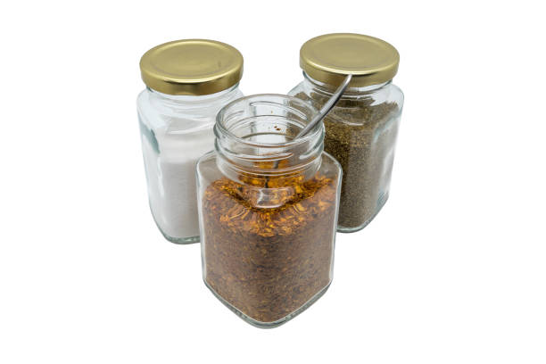 Three Glass Jars With Spices Chili Powder With Spoon Salt And Celery Seeds  Isolated On White With Clipping Path Stock Photo - Download Image Now -  iStock