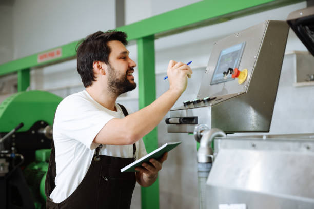 istock Man working at olives factory 1468291590