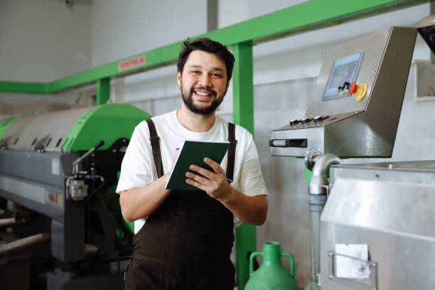 istock Man working at olives factory 1468293867