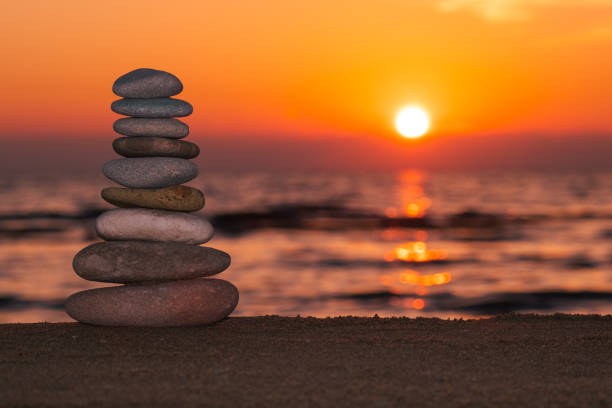 istock Stacked rocks on the beach with a sunset 1468296399