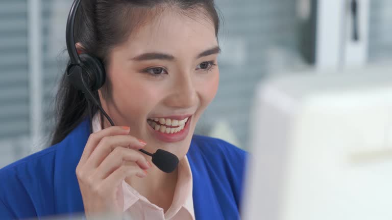 Businesswoman wearing headset working actively in office