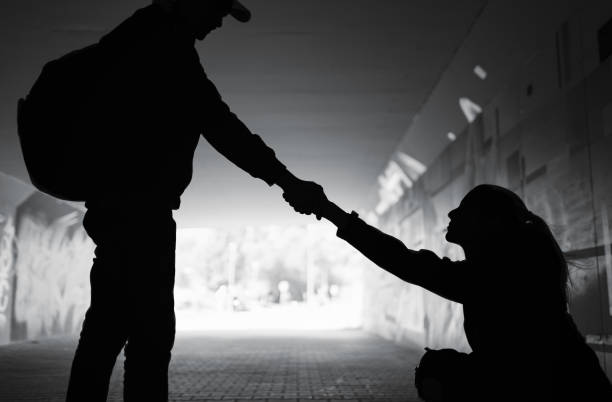 istock Man giving helping hand woman showing kindness and compassion . 1468298418
