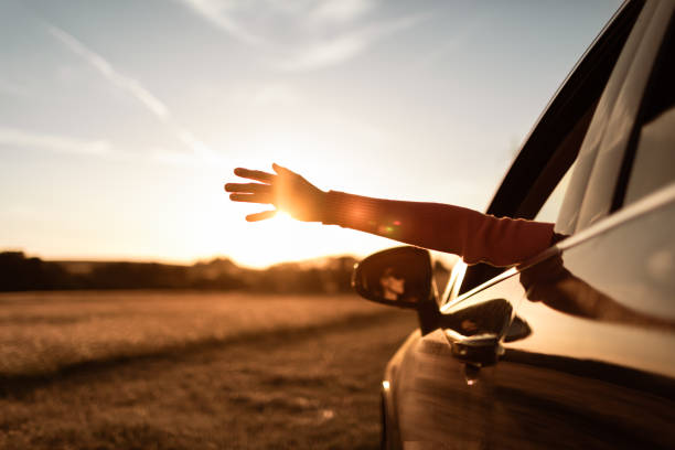istock Woman driving at sunset. 1468298777