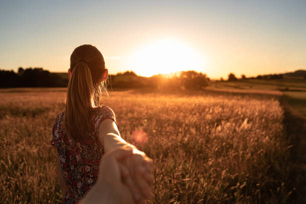 istock Couple walking into the sunset 1468298874