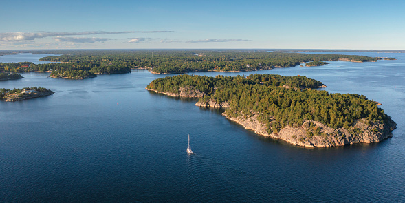 A sailboat among islands of the Stockholm archipelago in Värmdö municipality, Sweden.