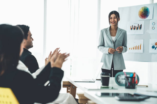 istock Businesswoman proficiently present work project receive celebrations from team . Corporate business team collaboration concept . 1468310008