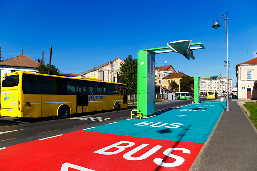 Sibiu, Romania - October, 8 2022: Electric bus charging stations for E-Bus fleets. Eco-friendly public transport in Sibiu, Romania. Bright sunny day