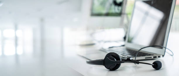 istock Headset and customer support equipment at call center ready for actively service . Corporate business help desk and telephone assistance concept . 1468311109