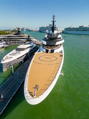 Miami, FL, USA - February 19, 2023: Aerial photo luxury Yacht AHPO front deck helicopter heli landing deck