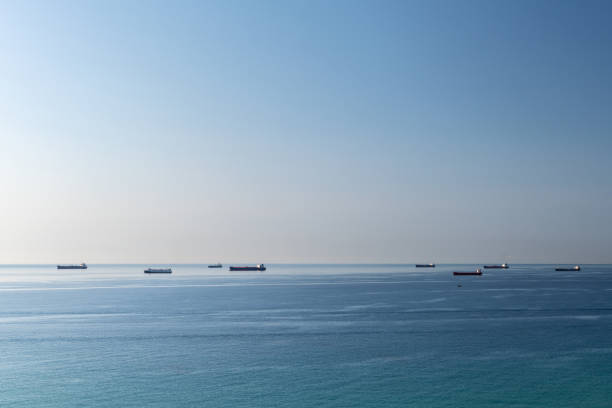 Cargo ships waiting in line to enter the port of Tarragona in the Mediterranean coast.