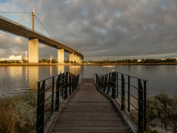istock Jetty and high bridge at sunset 1468317150