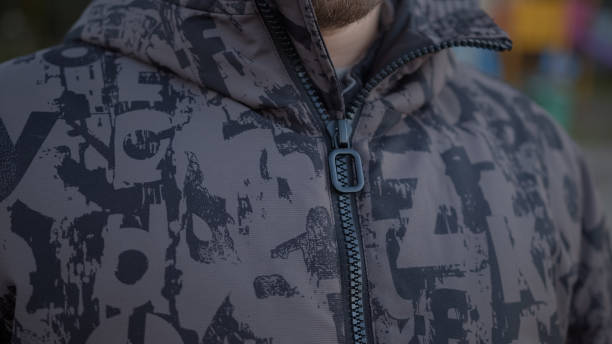 istock Closing his jacket zipper in close-up, cold weather concept 1468319429