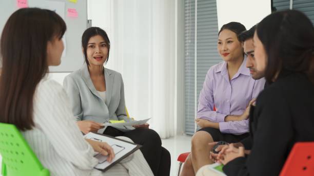 istock Business people proficiently discuss work project while sitting in circle . Corporate business team collaboration concept . 1468324253