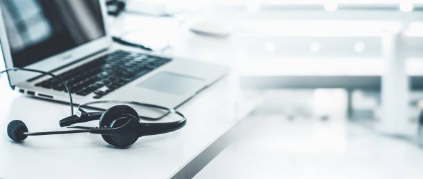 istock Headset and customer support equipment at call center ready for actively service . Corporate business help desk and telephone assistance concept . 1468324808