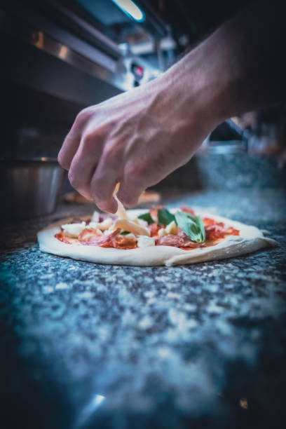 istock Pizzaiolo prepares Neapolitan pizza 1468326389
