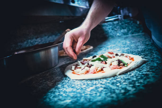 istock Pizzaiolo prepares Neapolitan pizza 1468326440