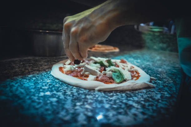 istock Pizzaiolo prepares Neapolitan pizza 1468326467