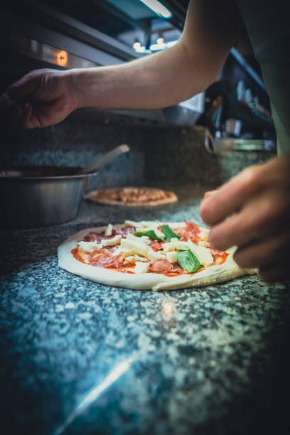 istock Pizzaiolo prepares Neapolitan pizza 1468326468