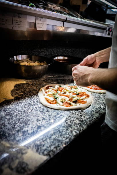istock Pizzaiolo prepares Neapolitan pizza 1468326687