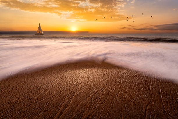 Sunset Ocean Sunset Inspirational Uplifting Sailing Nature Scenic stock photo