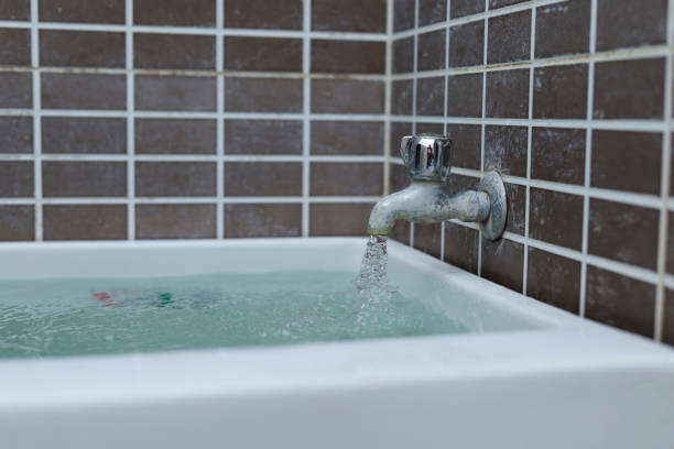 istock water flows from the faucet into the tub 1468328009