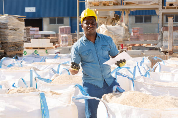istock Worker checking quality of building mix at hardware store 1468329217