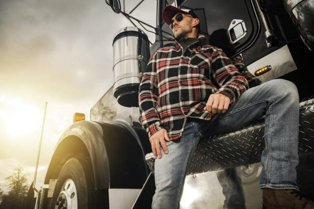 istock Professional Truck Driver Next to His Semi Tractor 1468329792