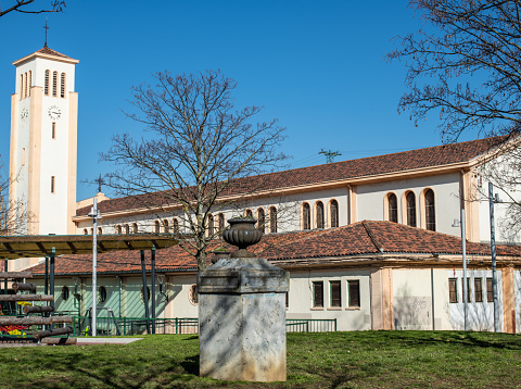 Church among trees with blue sky