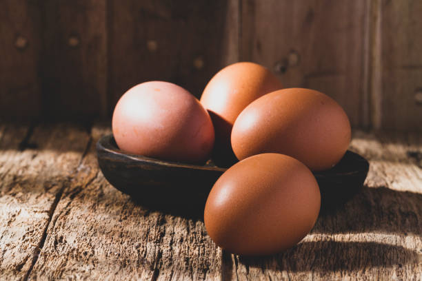 istock pile of eggs on rustic wood, close-up image 1468335905