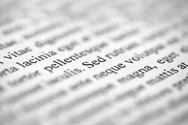 istock Lorem Ipsum on printed on paper on , middle of text, selective focus 1468337714