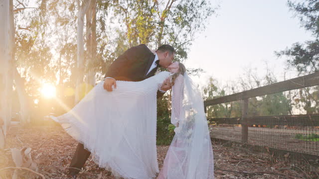 Bride and groom in love at sunset in nature at their wedding