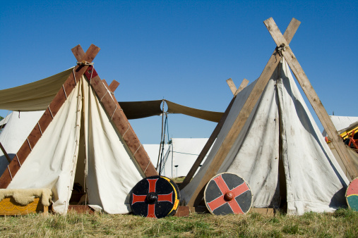 Vikings' A-type tents with shields around