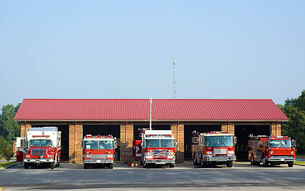 Fire House with trucks Fire house with trucks fire station stock pictures, royalty-free photos & images