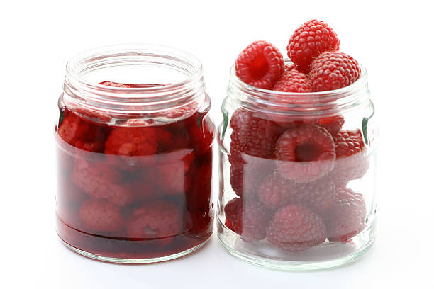 homemade preserved homemade preserved - raspberry syrup - alternative medicine hrant dink stock pictures, royalty-free photos & images