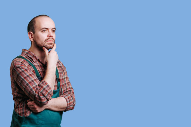 istock Meditative, handsome man in portrait a pensive, serious workman 1468346450