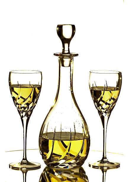 Two glasses and Carafe with white wine stock photo