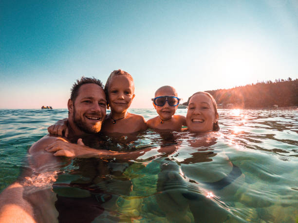 istock Happy Family Smiling while Wet 1468348212