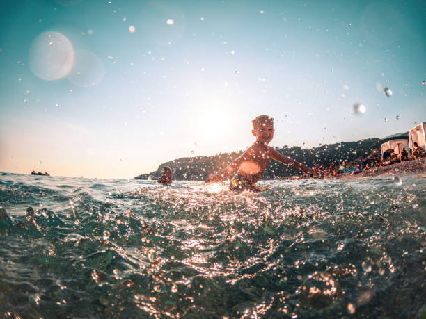 istock Little Boy Enjoying Summer at the Sea Coast 1468348224
