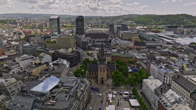 Oslo Norway v34 low level drone fly around cathedral church capturing bustling sentrum downtown cityscape, surrounded by historic buildings and waterfront view - Shot with Mavic 3 Cine - June 2022