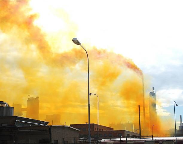 Yellow pollution Chimney emitting yellow nitrogen oxide fumes. oxides stock pictures, royalty-free photos & images