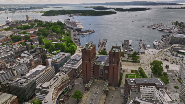 Oslo Norway v6 cinematic low level birds eye view capturing downtown cityscape sentrum district, drone flyover radhuset city hall with fjord waterfront view - Shot with Mavic 3 Cine - June 2022