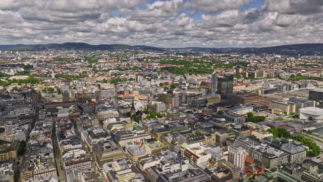 Oslo Norway v4 panoramic view drone flyover across sentrum and gamle neighborhood capturing bustling downtown cityscape and waterfront harbor from above at daytime - Shot with Mavic 3 Cine - June 2022