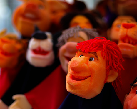 Handmade puppets on display for sale