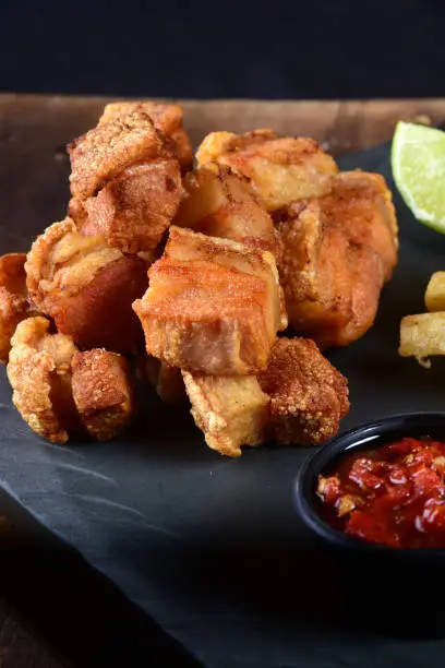 Photo of panceta fried pork skin crackling crackling with fries, typical Brazilian foodpanceta fried pork skin crackling crackling with fries, typical Brazilian food