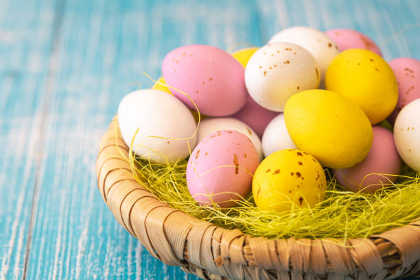 istock Easter candies, colorful chocolate eggs in a nest, close up. 1468357975