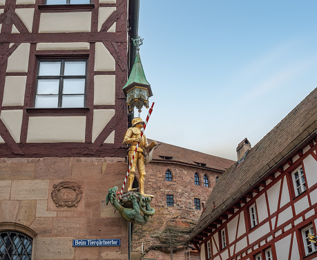 St. George and dragon Statue on a building at Tiergatnertor Square - Nuremberg, Bavaria, Germany