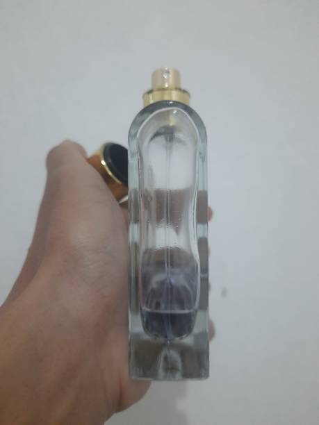 istock someone's hand holding a perfume bottle 1468358662